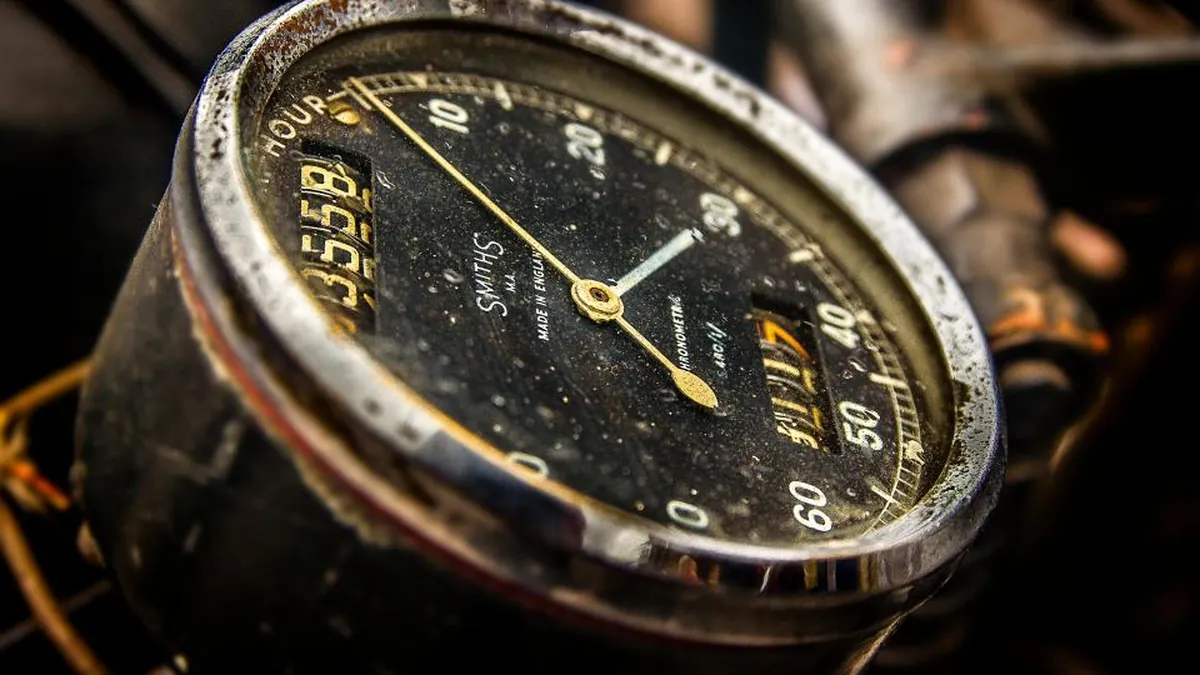 The dial of an old hour meter fitted to a machine, with the accumulated-hours counter in view.